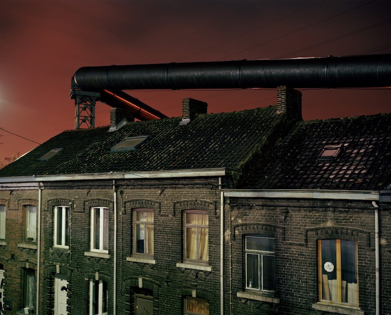 The gas supply tubes run along the houses built near the steel factories of Charleroi.
