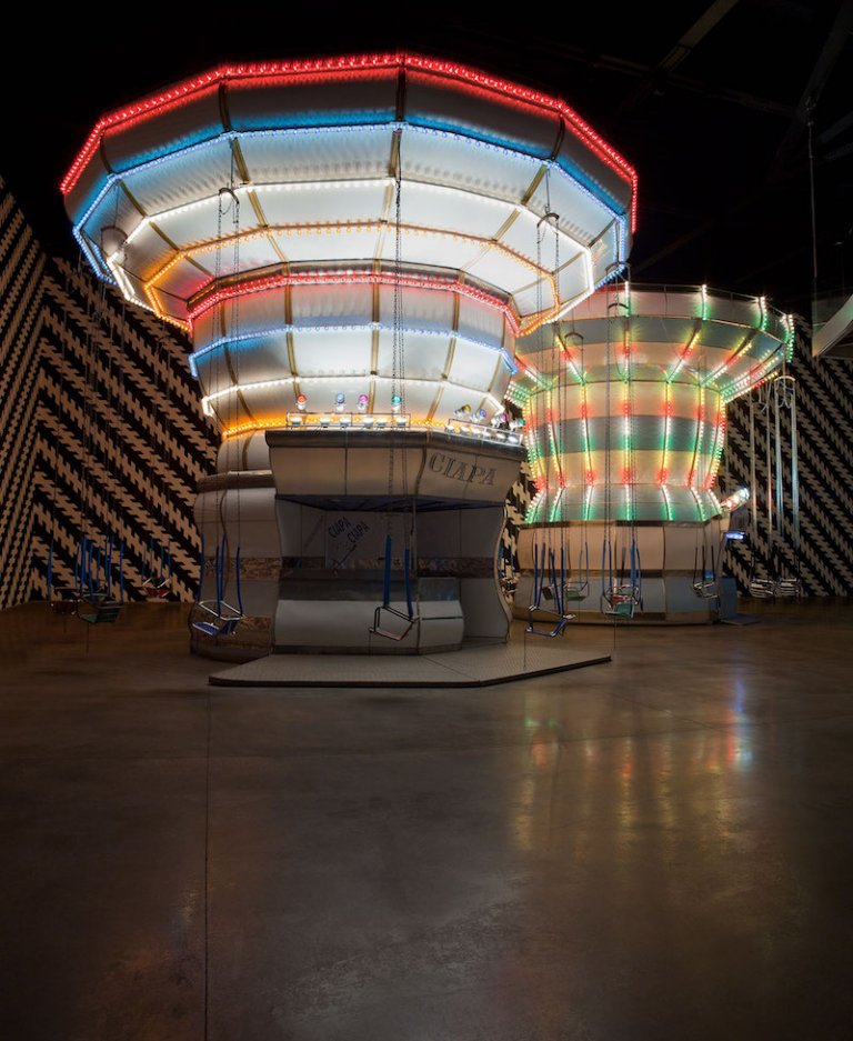 Carsten Höller
Double Carousel with Zöllner Stripes, 2011
Acciaio, lana di vetro, motori elettrici, controlli elettronici, lampadine, catene, legno, vernice Regina del Volo: h 686 cm; ø 813 cm
Ciapa Ciapa: h 717 cm; ø 892 cm Veduta dell’installazione, “Double Carousel with Zöllner Stripes, Enel Contemporanea Award 2011”, MACRO Museo d'Arte Contemporanea Roma, 2011 Foto: Attilio Maranzano Courtesy di Enel Contemporanea & MACRO, Museo d’Arte Contemporanea Roma, Roma, e dell’artista