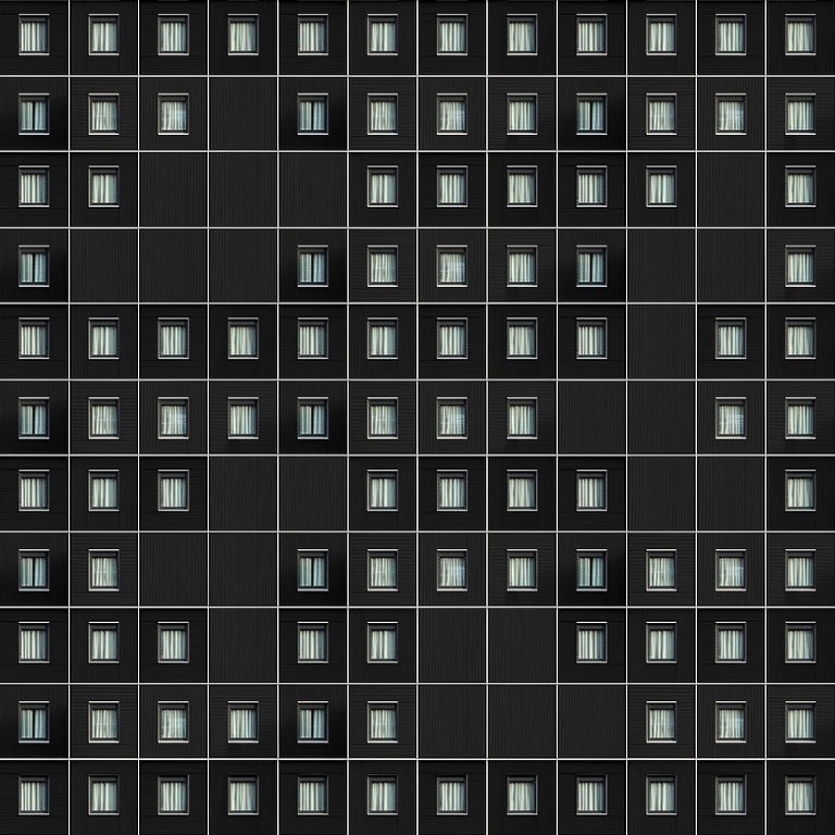 Le precisissime geometrie degli edifici nelle composizioni di Carlo Cafferini