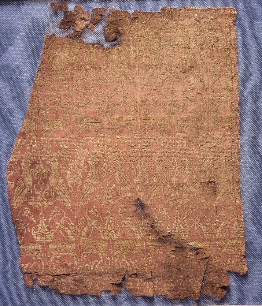 Fragments of the funerary robe of Henry VI, red-and-gold lampas silk, tomb of Henry VI, Palermo, Sicily, 1197 AD © The Trustees of the British Museum