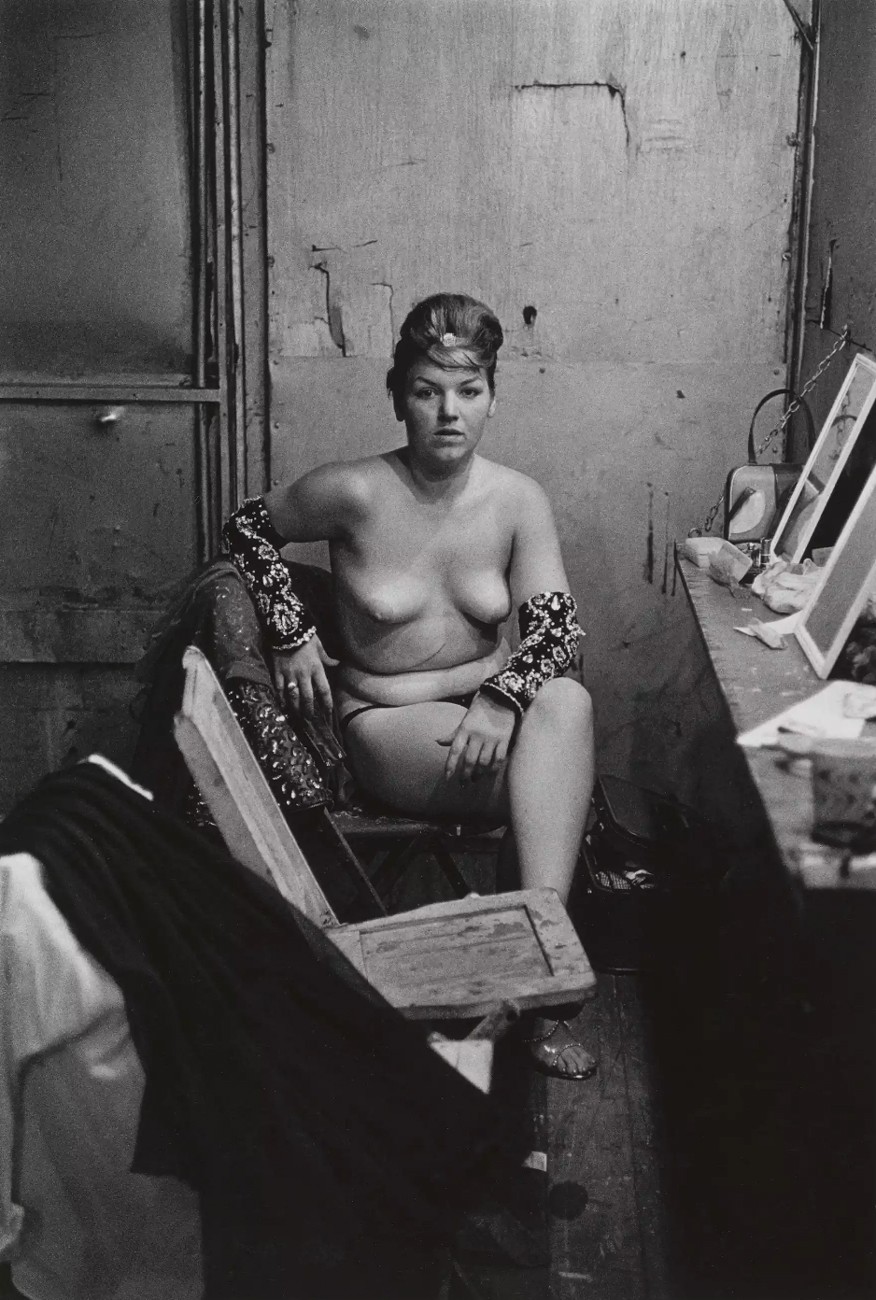 Stripper with bare breasts sitting in her dressing room, Atlantic City, NJ, 1961  © The Estate of Diane Arbus LLC