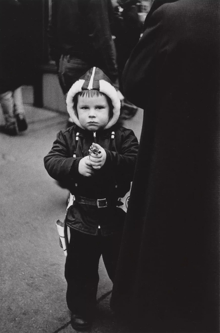 Kid in a hooded jacket aiming a gun, NYC, 1957  © The Estate of Diane Arbus LLC