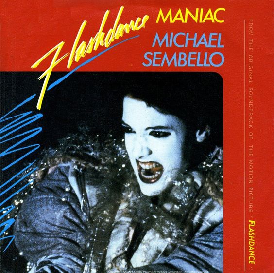 Un grande chitarrista turnista, sconosciuto al pubblico che scrive la canzone perfetta degli anni '80. Quando la sentite in giro iniziate a ballare a corsetta come in Flashdance? Lo facciamo anche noi.