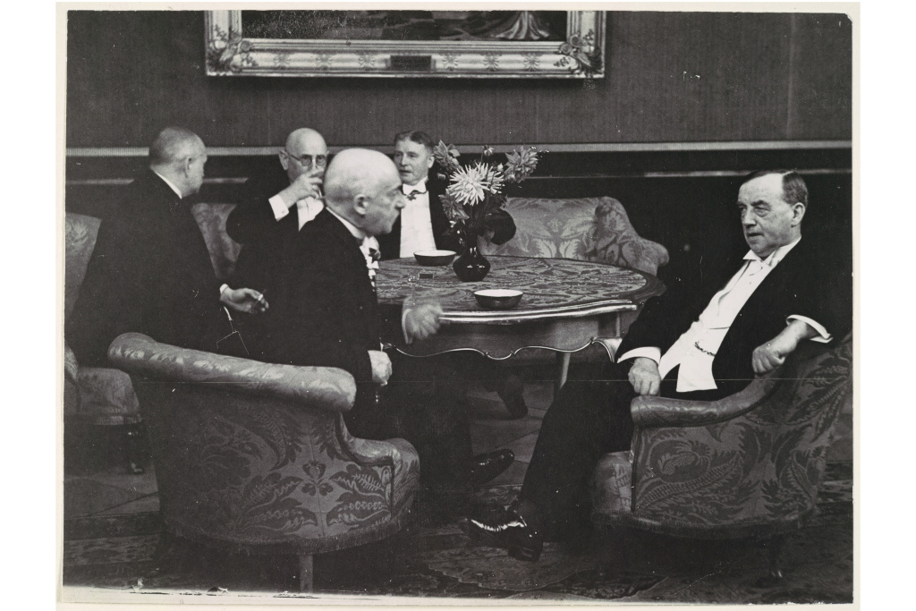 Five Gentlemen Conversing around Table. 1920s-30s. Erich Salomon