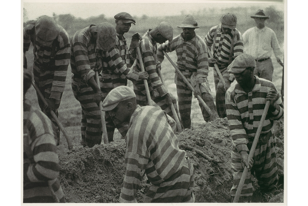 Prison Work Crew (ca. 9 Members) Digging Trench and 1 Guard. 1929-30, printed 1934. Doris Ulmann